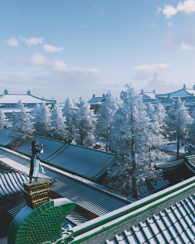 Traditional Chinese mansion with garden and pond at dusk